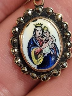 I will combine shipping on all purchases and refund any overages after shipping fees and insurance.In antique condition...has some damage to the enamel as seen in pictures. Unknown maker.The chain is approximately 19" long and is 10k gold.The pendant is 10k gold with Marcasites around the outside of the Porcelain painting.Please look at the pictures for details and condition or message me with any questions Mother Mary With Baby Jesus, Angel Brooch, Turquoise Hoop Earrings, Butterfly Brooch, Painted Porcelain, Baby Jesus, Vintage Butterfly, Yellow Gold Chain, Mother Mary