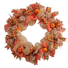 a wreath with oranges and plaid bows is shown on a white background for measurements