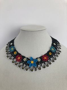 Handmade  Colorful Floral  Boho Necklace. 🌼 An elegant-looking, unique, and 100 % handmade needle lace Necklace. Beautifully crocheted by using special silk yarn and needles. 😍 The necklace is very pretty with beautiful details and made sturdy to use for a long time. 👗 This unique, handmade necklace is a charming piece of jewelry with beautiful colors and it will be a cute accessory to your dresses.   For more color options, please check out my other items here; https://www.etsy.com/shop/ElegantCraftShop?ref=simple-shop-header-name&listing_id=1192906089 An elegant and stylish gift for mothers, gift for grandparents, gift for aunts, gift for girlfriends, gift for teachers, or a special treat for yourself. This cameo necklace will make a nice anniversary gift, Mother's Day gift, Christmas Handmade Delicate Flower Beaded Necklaces, Handmade Delicate Flower Beaded Necklace, Handmade Bohemian Flower Necklace For Wedding, Delicate Handmade Flower Beaded Necklace, Beaded Boho Necklace, Lace Necklace, Cameo Necklace, Needle Lace, Silk Yarn