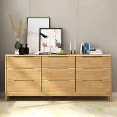 a large wooden dresser with pictures on it