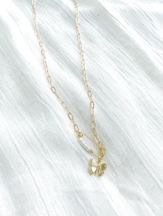 Gold plated pendants. Gold plated paperclip chain. 18.5" in length Trendy Gold Plated Dangle Necklaces, Dainty Paperclip Chain Link Charm Necklaces, Dainty Charm Necklaces With Paperclip Chain, Dainty Paperclip Chain Link Charm Necklace, Trendy Gold Paperclip Necklace, Trendy Jewelry With Delicate Paperclip Chain, Trendy Paperclip Jewelry With Delicate Chain, Trendy Gold Charm Necklace With Delicate Chain, Silver Gold-plated Paperclip Chain Necklace