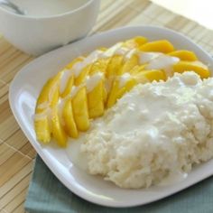 rice and mango slices on a white plate