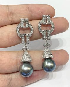 We are presenting you a HUGE pair of Art Deco, CHANDELIER, Genuine, LUSTROUS GRAY TAHITIAN, South Sea Pearls, extremely FINE AA+, LUSTROUS and Rare! Accenting the 2 pearls are 102 pieces of E/VS Natural diamonds, weighting a total of 1.65 carats. Set in GORGEOUSLY designed 18K solid white gold Art Deco earrings! PERFECT FOR SPECIAL OCCASIONS! SO BIG AND GORGEOUS! EVERYONE WILL FALL IN LOVE WITH THEM THE MINUTE THEY SEE YOU WEARING THEM! ONLY ONE ITEM AVAILABLE!! NO DUPLICATES!! WHAT YOU SEE IN T Elegant Tahitian Pearl Earrings For Wedding, Luxury Tahitian Pearl Wedding Earrings, Luxury Black Tahitian Pearl Earrings, Tahiti Wedding, Gold Art Deco Earrings, Deco Chandelier, Earrings Chandelier, Deco Earrings, Art Deco Chandelier