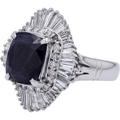 Engage with the elegance of timeless sophistication embodied in the Platinum 900 5.11 Carat No Heat Burma Sapphire Ballerina Ring. This exquisite piece exudes luxury and exclusivity, showcasing a magnificent 5.11- Carat natural Burmese sapphire as its focal point. The allure of this rare gemstone is further enhanced by a surrounding halo of 1.62 Carats of brilliant diamonds, set in lustrous Platinum 900.Imagine the captivating sparkle and deep, rich hues of the sapphire, evoking a sense of mystery and allure. The intricate ballerina setting adds a touch of whimsy and grace to the design, making it a truly unique and enchanting piece. Whether worn as a statement accessory or a symbol of love and commitment, this ring is sure to make a lasting impression.Indulge in the opulence of fine craft Luxury Gia Certified Cushion Cut Sapphire Ring, Formal Sapphire Ring With Brilliant And Cushion Cut, Formal Sapphire Ring With Cushion Brilliant Cut, Gia Certified Classic Evening Jewelry, Luxury Gia Certified Baguette Cut Sapphire Ring, Formal Cushion Cut Sapphire Ring With Diamond, Luxury Sapphire Ring With Brilliant And Baguette Cuts, Formal Fine Jewelry Sapphire Cushion Cut Ring, Luxury Cushion Cut Diamond Ring For Formal Events