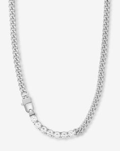 Chains + Diamonds = The Best of Both Worlds. Our best-selling Julian Cuban Chain Necklace becomes even more dazzling when simulated diamonds are added to the mix. Why? Because no one has ever been disappointed by adding diamonds.DETAILS: Cuban Chain Necklace Length: 18” Width: 6mm Signature MM Padlock Clasp SKU: N6361 Crystal Cuban Link Jewelry With Adjustable Chain, White Gold Cuban Link Tennis Necklace, Dazzling Cubic Zirconia Chain Necklaces, Dazzling Cubic Zirconia Chain Necklace, Classic Diamond Jewelry With Chain, Classic Diamond Chain Link Necklace, Crystal Cuban Link Necklace With Adjustable Chain, Classic Diamond Tennis Necklace With Adjustable Chain, White Gold Diamond Tennis Necklace With Adjustable Chain