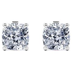 pair of square cut diamond stud earrings in 18k white gold with 0 00 carat total weight