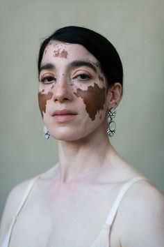 a woman with mud on her face