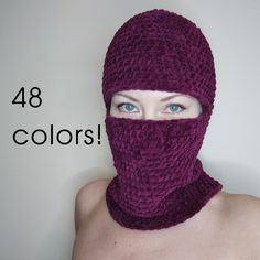 a woman wearing a purple knitted mask with the words 48 colors above her head