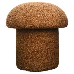 a brown stool with a large cushion on it's top and bottom, sitting in front of a white background