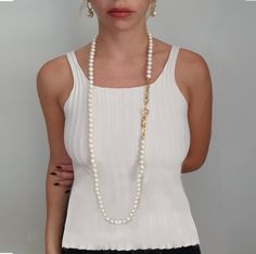 "A white pearl necklace is a staple for any well-dressed woman. Our classic mother of pearl beaded long pearl necklace adds elegance and sophistication to any look, whether you're at work or celebrating a special occasion. Add this perennial favorite to your jewelry collection today! Our beautiful white bead long necklace is the perfect graduation gift for a young woman just starting out in the real world. She'll get many years of use out of this lovely handmade accessory. Whether you're giving Classic Pearl White Necklace For Party, Classic Pearl White Pearl Necklace For Party, Classic Pearl Necklace For Party, Classic Pearl Necklace With Pearl Chain For Parties, Classic Akoya Pearl Necklace For Evening, Elegant Beaded Necklace With Pearl Pendant For Party, Elegant Pearl White Beaded Necklaces For Gift, Elegant Pearl White Beaded Necklace For Gift, Elegant Party Beaded Necklace With Pearl Pendant