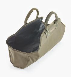 an open bag with handles and straps on the inside is sitting in front of a white background