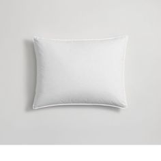 a white pillow on a gray background