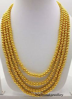 Traditional slop pattern vintage design handmade fabulous 20karat yellow gold beads necklace , bead mala.Each gold beads contains wax inside for durability, Gross Weight-43.500 grams approx. Metal-20karat yellow gold. brand-handmade. condition-excellent condition 4 line necklace. length-adjustable with back thread knot. makes excellent gift item and collection piece for more information please see the photo's gold jewelry is handmade designer jewelry. so, there can be slight difference in size and weight of the article in the comparison of the description. Gold Jewelry With 108 Round Beads, Gold Mala With 108 Beads As Gift, 22k Gold Round Beads Yellow Necklace, Yellow 22k Gold Necklaces With Round Beads, Gold Mala With Round Beads For Festivals, Gold Temple Necklace With Round Beads For Festivals, Yellow 22k Gold Necklace With Round Beads, Gold Polished Beads Mala For Wedding, Gold Temple Necklace With Round Beads