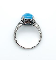 "Art Deco Sterling Silver Pools Of Light Blue Topaz Ring Up for offer is a stunning art deco revival solid sterling silver genuine blue topaz pools of light cabochon ring. Rings are marked \"925\". Measurements Blue Topaz: 10mm x 10mm x 5.5mm/ 5.27cttw Bad Width: 2mm Weight: 3.3 g Materials -Sterling Silver -Blue Topaz Condition: New; Please look closely at the pictures provided as they are an extension of the written description. This item comes from a clean, smoke free household. Item will shi Blue Cabochon Ring In Fine Jewelry Style, Blue Cabochon Fine Jewelry Ring, Blue Cabochon Dome Ring, Fine Jewelry Blue Cabochon Ring, Elegant Collectible Cabochon Turquoise Ring, Blue Domed Jewelry With Polished Finish, Art Deco Rings With Oval Cabochon Polished Finish, Blue Domed Gemstone Ring, Formal Cabochon Blue Topaz Jewelry