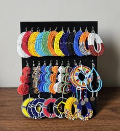 This listing is for ALL 29 pairs exactly as shown in the photo. The earrings are 100% handmade using original fine beads. Colorful and bright colors. Size: 2" to 4" long. ^^These earrings ships through dhl express.  More earrings; https://www.etsy.com/shop/TribalTess?ref=seller-platform-mcnav§ion_id=21293980 Buy multiple items and pay shipping for ONE item ONLY. African Earrings, Maasai, Ear Jewelry, Jewelry Earrings Hoops, Earring Set, Christmas Gifts, Jewelry Earrings, Women Jewelry, Display Homes