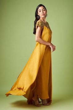 Shop for Aakaar Yellow Matka Silk Yoke Embellished Maxi Dress for Women Online at Aza Fashions Festive Embellished Maxi Dress For Designer Wear, Designer Mirror Work Maxi Dress, Hand Embellished Maxi Dress For Festive Occasions, Designer Maxi Dresses With Sequins, Embellished Maxi Dress For Festive Occasions, Designer Embellished Floor-length Maxi Dress, Designer Floor-length Embellished Maxi Dress, Festive Maxi Dress With Embroidered Neckline, Festive Embellished Maxi Dress