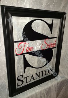 the sign for stanton's tom and sandal restaurant is displayed in a black frame