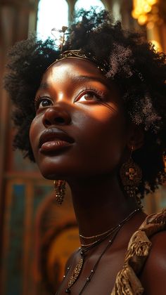 a woman with an afro is looking up at the sky and has her eyes closed