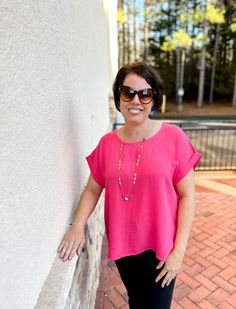 Who doesn't love a pop of color?! Experience effortless style and comfort with our Casual Dolman Sleeve Top in Hot Pink. Made with dolman sleeves and a round neckline, this top is perfect for any casual occasion. Enjoy the beautiful color and non-sheer fabric, making it an essential addition to your wardrobe. ABOUT THIS ITEM: Made in Vietnam. Fabric is 100% Polyester. Hand wash in cold water. Hang or line dry. The Model is 5'6, and wearing a medium. Dolman Sleeve Top, Maxi Tops, Dolman Sleeve Tops, Fabric Making, Jumpsuit Shorts Rompers, Loungewear Sets, Sheer Fabric, Sleeveless Sweater, Tunic Sweater