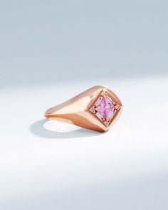 Crafted in 18-karat gold, this signet ring is set with a 4x4mm princess-cut pink sapphire center stone and surrounded by baguette and round white diamonds. Details 18k rose gold 4x4mm princess-cut pink sapphire center, 0.44 carats 0.12 carats of baguette and round white diamonds 10mm width Ref: BAR1055P Luxury Pink Gold Ring With Pink Sapphire, Rose Gold Pink Sapphire Rings For Formal Occasions, Luxury Sapphire Rose Gold Ring, Luxury Pink Sapphire Promise Ring, Luxury Rose Gold Square Cut Ring, Luxury Pink Rectangular Rings, Luxury Rectangular Pink Rings, Rose Gold Signet Ring With Rose Cut Diamonds, Luxury Rose Gold Sapphire Ring With Center Stone