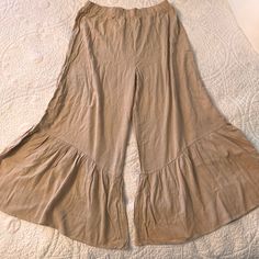 Light Weight Comfortable Pants. Mint Condition, Never Worn. Still Has Tag. Casual Flare Bottoms With Elastic Waistband, Flare Bottoms In Solid Color For Summer, Solid Flare Bottoms For Summer, Flared Solid Bottoms For Summer, Summer Solid Color Flare Bottoms, High Waist Beige Bottoms For Brunch, Summer Flared Bottoms With Relaxed Fit, Spring Wide Leg Bottoms For Brunch, Beige Bottoms For Spring Brunch