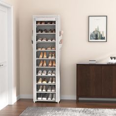 a white cabinet with shoes on it in a room