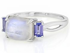 Introducing our captivating Rainbow Moonstone Rhodium Over Sterling Silver Ring! This delightful piece is a true gem that will bring a pop of color and sparkle to your ensemble. The enchanting rainbow moonstone shimmers with hues reminiscent of the dancing colors in the sky after rain, making it an absolute showstopper. With 0.53ctw, this ring strikes the perfect balance between elegance and playfulness. Add a touch of whimsy to your jewelry collection with this stunning statement piece! Measure Fusion Style Moonstone Gemstone Ring For Anniversary, Fusion Style Anniversary Moonstone Gemstone Ring, Anniversary Fusion Style Moonstone Gemstone Ring, Anniversary Fusion Style Moonstone Ring, Fine Jewelry White Gold Multi-stone Moonstone Ring, White Multi-stone Moonstone Ring, Silver Multi-stone Moonstone Ring, Fine Jewelry Sterling Silver Multi-stone Moonstone Ring, Silver Multi-stone Moonstone Ring In Sterling Silver