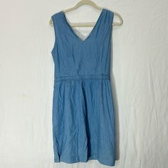 Nwt Levis Dress In A Light Wash, Size L .It Has Pockets On Each Side Of The Dress, A Back Zipper, And A Self-Tie Back For Adjusting The Fit Of The Bust Levi's Casual Denim Dress For Summer, Levi's Casual Denim Summer Dress, Levi's Casual Summer Denim Dress, Levi's Casual Mini Dress, Levi's Casual Dresses For Spring, Levi's Casual Spring Dresses, Casual Levi's Dresses For Spring, Levi's Summer Denim Cotton Dress, Levi's Sleeveless Dress For Spring