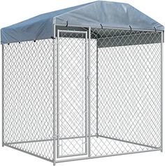 a large metal dog kennel with a cover on top