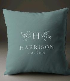 a blue pillow with the name harrison on it