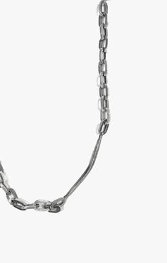 a silver chain is shown on a white background