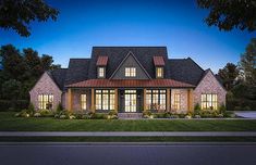 this is an artist's rendering of the front elevation of a modern home at dusk