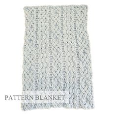 a white knitted blanket with the words pattern blanket written in black on top of it