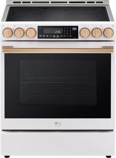 a white stove top oven with two burners and an electronic timer on the front