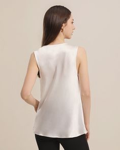 100% Mulberry Silk Breathable & Lightweight Lightweight & Comfortable Silk Sleeveless BlouseStyle: One-piece Silk TopSleeve Type: SleevelessMaterial: 100% 19 Momme Charmeuse Silk. Romantic and alluring, mulberry silk likes a second skin, the smooth, silk fabric will effortlessly caress your body for the ultimate comfort whatever the occasion. This silk blouse is a perfect design for summer. The Swing collar design gives it a trendy and fashionable look, while the sleeveless design keeps you cool