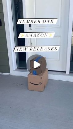 an amazon box sitting in front of a door with the words number one, amazon new releases