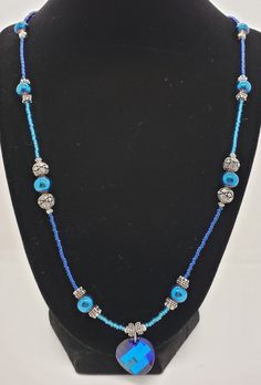 Who says feeling blue has to be a bad thing? This Eclectic Blue piece will be sure to light up your wardrobe and make people notice you! While the necklace is 28.5 inches long, there is still a magnetic clasp adorned with sparkle as well. Silver/Antiqued Silver/Gold-plated Terra Cast Heishi beads accent with the appearance of precious metals, but not the cost.  Easy on and off with a magnetic closure means no fumbling with a tiny clasp.  Made with quality materials to last a lifetime of compliments! Please note; not all computers have the same color display settings and may not be the color you expected. Please allow for natural variations in the beads, stones, and metal components. Blue Single Strand Long Beaded Necklace, Blue Long Single Strand Beaded Necklace, Blue Adjustable Long Necklace, Blue Beaded Long Necklace With Round Beads, Blue Beaded Long Necklace As Gift, Blue Beaded Long Necklace For Gift, Gift Blue Beaded Long Necklace, Blue Adjustable Lariat Long Necklace, Handmade Blue Long Necklace For Gift