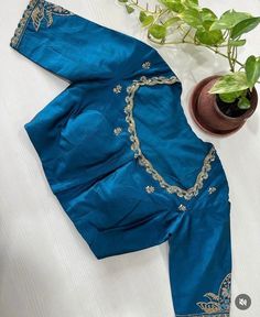 Hand embroidered ready made saree blouse / crop top/stitched saree blouse usa / saree blouse/modern blouse/zardosi blouse/blue saree blouse/ pure silk blouse/ maggam work blouse / white blouse        It is very true that a perfect blouse is the one which makes your saree look stand out !! If you find one of such a style that you have been wanting to have then dont let it go !! we carry such unique trending blouses that instantly add a stylish look to any saree !!     Well..!! we understand that you may not get in your desired size/pattern, here you go with customization according to your size/pattern which we can deliver in 1-2 weeks of time period !!      Here is a beautiful Hand embroidered saree blouse/ crop top  in sea green color that has embossed multi embroidery on sleeves and neck Blue Fitted Traditional Embroidered Top, Blue Fitted Embroidered Top For Festive Season, Festive Blue Fitted Embroidered Top, Fitted Embroidered Blue Top For Festive Season, Fitted Blue Embroidered Top For Festive Season, Blue Silk Choli With Floral Embroidery, Blue Dori Work Blouse For Diwali, Designer Blue Blouse With Floral Embroidery, Festive Blue Lehenga With Handwork