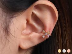 Available in 3 colours ✦ 18k gold plated ✦ Rhodium plated ✦ 18k rose gold plated Quality & Detail ✦ Ear cuff : Your ears don't have to be pierced to wear this product. ✦ Fits any ear as it is adjustable. ✦ Semi-precious gemstones : Rose quartz, Citrine ✦ The height 10.1mm ✦ The width 11mm ✦ Cubic zirconia size 2.5mm ✦ Bigger Flower size 7mm ✦ Smaller Flower size 4.2mm ✦ Tiny butterfly size 2.3mm ✦ Sold individually : Comes in a cute little package ready for gifting Shipping from United Kingdom Rose Gold Pierced Ear Cuff As Gift, Dainty Rose Gold Ear Cuff, Delicate Hypoallergenic Ear Cuff For Gifts, Elegant Flower Shaped Ear Cuff As Gift, Hypoallergenic Rose Gold Ear Cuff Gift, Butterfly Cute, Tiny Butterfly, Wrap Earrings, Quartz Rose