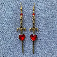 Queen Of Hearts Earrings Handmade Color: Red, Gold And Silver Length: Approximately 3 Inches Modern Queen Of Hearts Outfit, Red Drop Earrings For Valentine's Day, Valentine's Day Metal Heart Dangle Earrings, Red Metal Earrings For Valentine's Day, Red Dangle Heart Earrings For Anniversary, Handmade Red Heart Cut Jewelry, Red Nickel-free Dangle Heart Earrings, Red Double Heart Jewelry For Jewelry Making, Red Heart Charm Metal Earrings