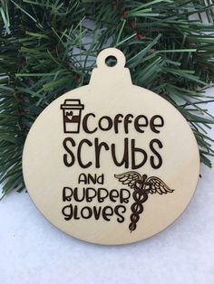 a wooden ornament with the words coffee scrubs and rubber gloves on it