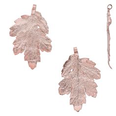 two leaf shaped pendants are shown on a white background, one is pink and the other is gold