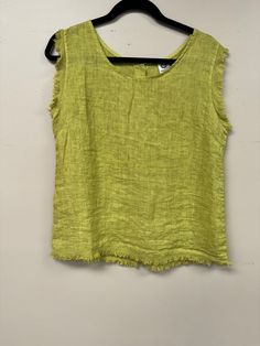 Elevate your wardrobe with our Italian Linen Distressed Hem Tank Top! Made with premium linen, it offers a comfortable and loose fit, perfect for any body size (s-l). The buttoned back, scoop neckline and distressed hem add a touch of style to this basic, versatile piece. Easy to wear, easy to love! Green Linen Tank Top For Summer, Chic Tops With Frayed Hem For Everyday, Chic Everyday Top With Frayed Hem, Chic Everyday Tops With Frayed Hem, Casual Distressed Sleeveless Top, Summer Linen Tops With Frayed Hem, Spring Linen Tops With Frayed Hem, Chic Washed Summer Tops, Summer Tops With Frayed Hem For Layering