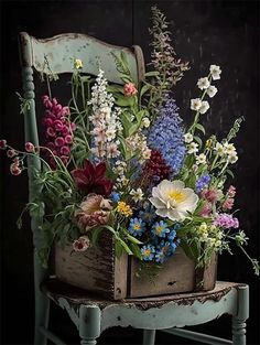 an old chair with flowers in it