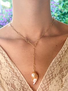 Peach Japanese Keshi Pearl Necklace on Gold Nautical Chain by Sage Machado - The Sage Lifestyle Artisan Pearl Pendant Necklace, Pearl Lariat Necklace With Chain, Handmade Yellow Gold Lariat Jewelry, Handmade Elegant Pendant Chain Necklace, Elegant Handmade Pendant Chain Necklace, Unique Gold Necklace With Adjustable Chain, Gold Briolette Single Strand Jewelry, Unique Single Strand Gold Jewelry, Unique Gold Single Strand Jewelry