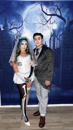 a man and woman dressed up in halloween costumes