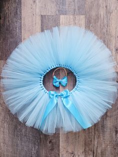 This gorgeous light blue tutu skirt is perfect to add to your little one's big day Makes a wonderful gift for Birthday, a photoshoot or just to dress up!!  It would also be great as a baby shower gift!! The tulle of the tutu is hand knotted on a double side satin ribbon to be tie in a bow at the back or the front.   I will need your little one's waist measurement, all around the waist where the tutu will sit. Waist up to 21". If you prefer a simple bow as hair accessory, add the satin bow nylon Cute Blue Tutu Dress For First Birthday, Light Blue Princess Tutu Dress For Birthday, Blue Princess Tutu Dress For First Birthday, Princess Style Blue Tutu Dress For First Birthday, Cute Blue Tutu Dress For Birthday, Blue Tulle Skirt Tutu Dress For Birthday, Blue Tutu Skirt, 1rst Birthday, Simple Bow