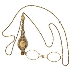 This vintage collectible lorgnette necklace is crafted in solid 14k yellow gold. It is very well detailed and features floral patterns throughout with an olympic style torch on both sides of the design. The lorgnette slides on a long, 35 inches rope link chain. The original finish and patina are intact and the piece remains in excellent overall physical and mechanical condition and is a great add to your collection. Enjoy :) Material: Solid 14k Yellow Gold (maybe slightly under karat due to age of production) Weight: 56.16 Grams Chain Type: 2.8mm Rope Link Chain Length: 35 Inches Clasp: Spring Ring Lorgnette Overall Length: 114.3mm (4.5") Lorgnette Overall Width: 28.4mm (1.1") Thickness: 12.1mm Condition: Vintage collectible piece in excellent overall physical and mechanical condition. Ori Opera Glasses, Historical Dress, Rope Chain Necklace, Dress Tutorials, Historical Dresses, Rope Chain, Floral Patterns, Spring Rings, Link Chain