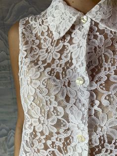 "Ivory White Lace Vintage blouse Sheer Lace Blouse Button Up Summer Blouse Floral Vintage Romantic Bohemian Medium to Large Size N.B. Color may slightly differ from picture. Estimated size: M/L Measurements (laying flat): Bust: 21,5\" / 54 cm Waist: 25\" / 64 cm Length: 28\" / 71 cm Please check measurements to insure a proper fit. Remember to allow yourself some extra room for movement. You can compare these with something from your closet that fits you well. Please convo me if you need additio Beige Lace Collar Blouse For Summer, Elegant Button-up Wedding Blouse, Summer Party Blouse With Buttons, White Bohemian Blouse With Button Closure, Elegant Lace Tops With Collar, Cream Blouse With Lace Collar For Summer, Party Blouse With Collar And Buttons, Elegant Collared Lace Blouse, Bohemian Collared Blouse With Buttons