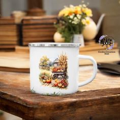 a white coffee mug sitting on top of a wooden table